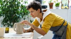 Young woman working on ceramics in her own studio